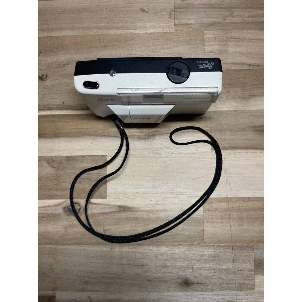 Kodak White Breeze Point-and-Shoot Camera with Black Strap and Pink Accents
